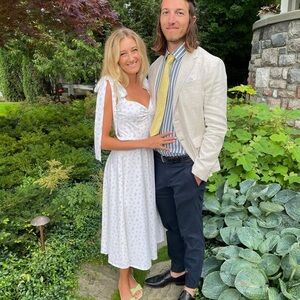 House of CB white midi dress with little floral details.